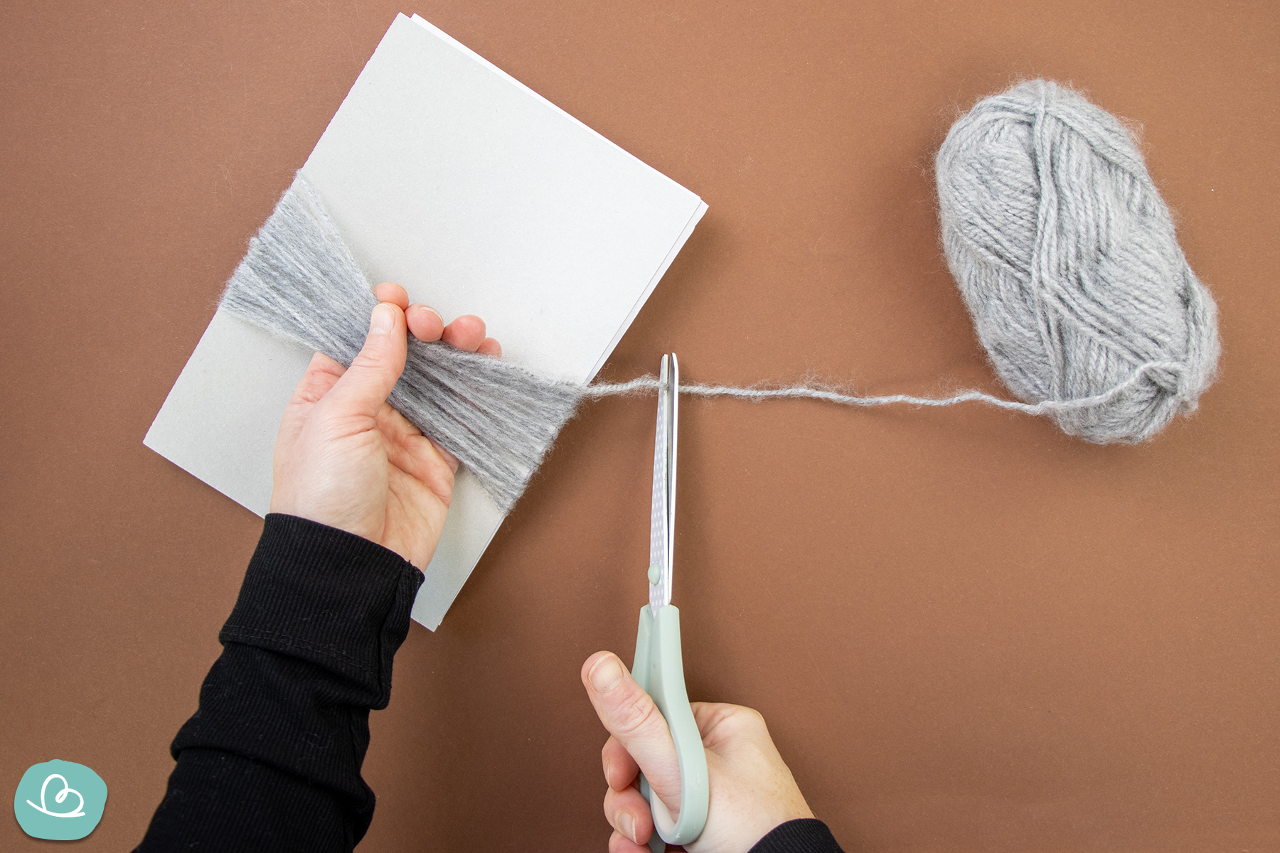 Wollfaden abschneiden