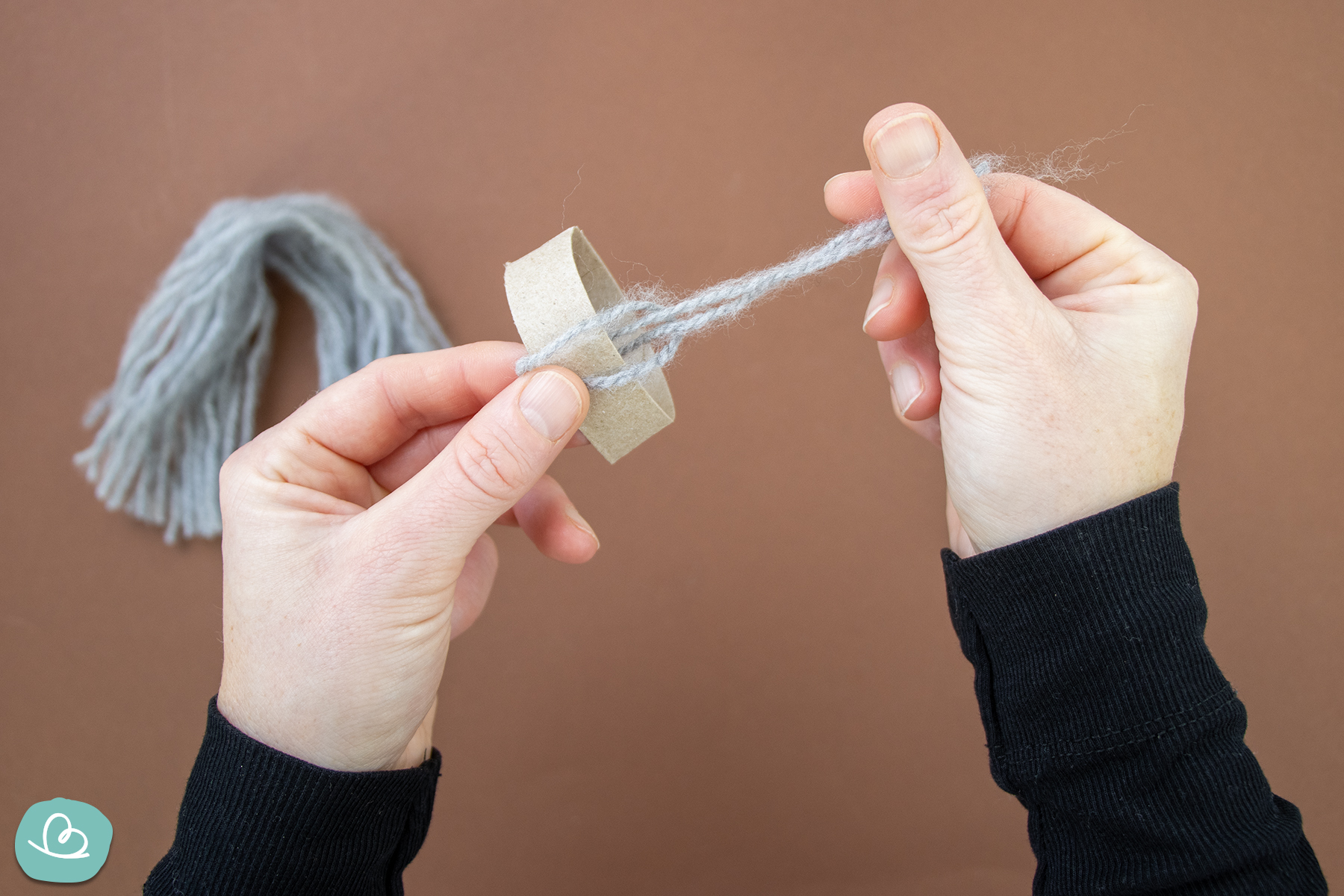 Schlaufe aus Wollfaden